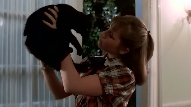 Night of the Creeps - Karen June Harris holding up black cat Gordon
