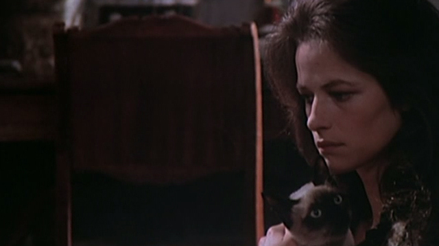 The Night Porter - Lucia Charlotte Rampling holding Siamese cat