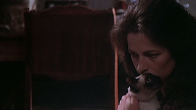 The Night Porter - Lucia Charlotte Rampling kissing Siamese cat
