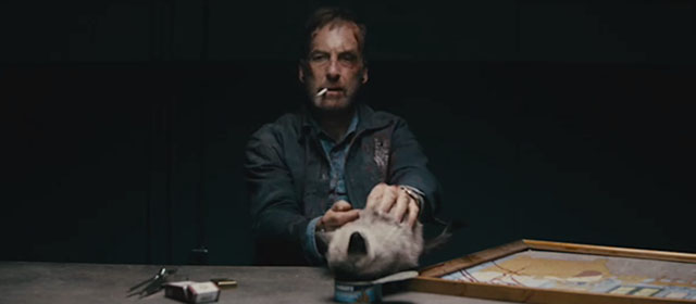 Nobody - Hutch Mansell Bob Odenkirk with tiny seal point Siamese kitten on table