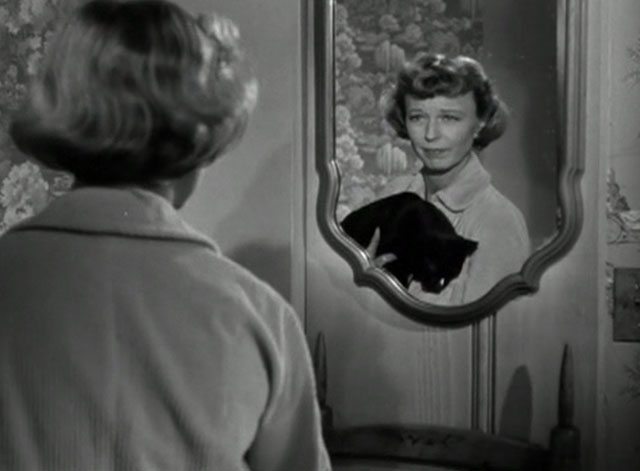 No Sad Songs for Me - Mary Margaret Sullavan holding black cat with white spot on nose while looking in mirror
