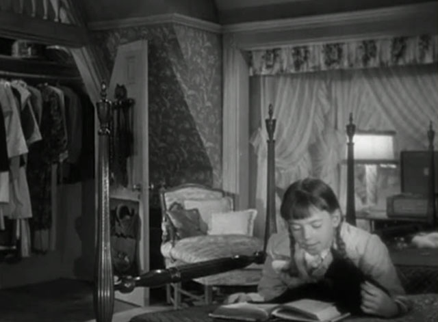 No Sad Songs for Me - Polly Natalie Wood lying on bed reading with black cat with white spot on nose Horace