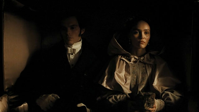 Nosferatu - Ellen Lily-Rose Depp and Thomas Nicholas Hoult in carriage with silver tabby cat Greta