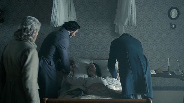 Nosferatu - Ellen Lily-Rose Depp lying on bed with silver tabby cat Greta and Professor von Franz Willem Defoe