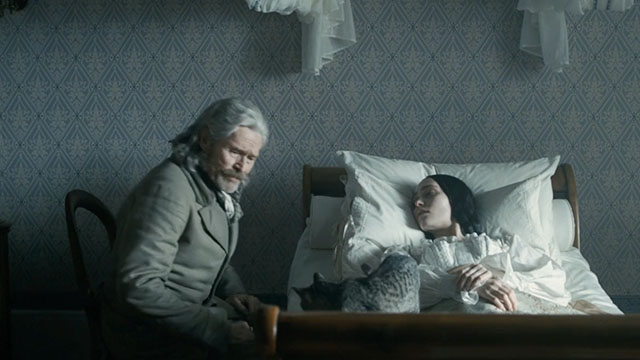 Nosferatu - Ellen Lily-Rose Depp lying on bed with silver tabby cat Greta and Professor von Franz Willem Defoe