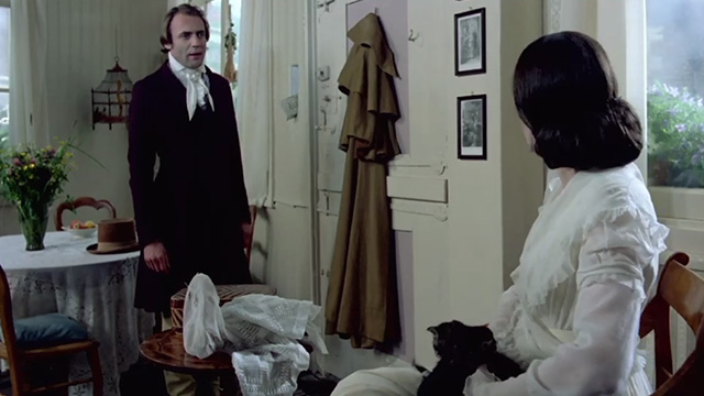 Nosferatu the Vampyre - Jonathan Harker Bruno Ganz talks to Lucy Isabelle Adjani with tabby and white kittens on her lap