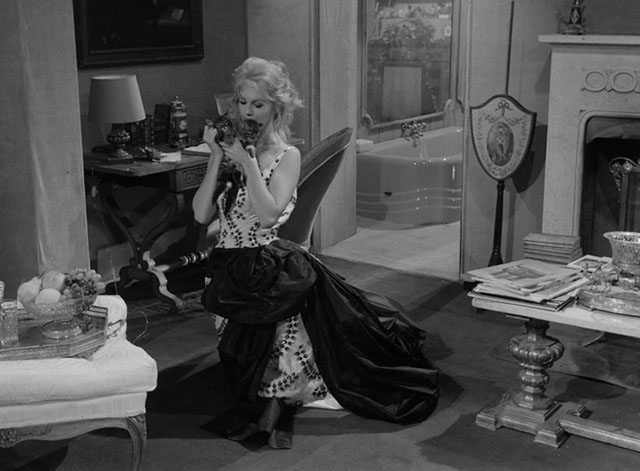 La notte brava - Laura Mylène Demongeot kneeling on floor holding two longhair tabby kittens