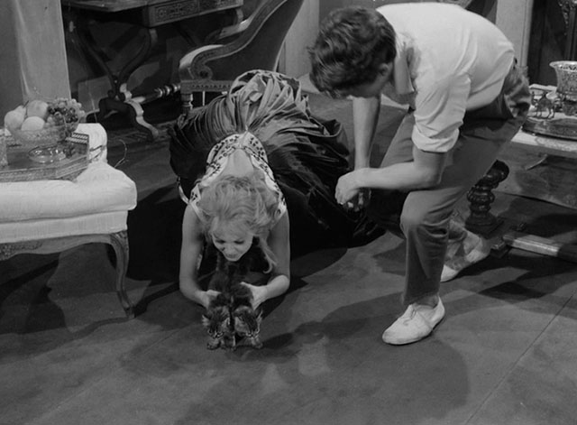 La notte brava - Laura Mylène Demongeot leaning down to the floor holding two longhair tabby kittens with Ruggeretto Laurent Terzieff