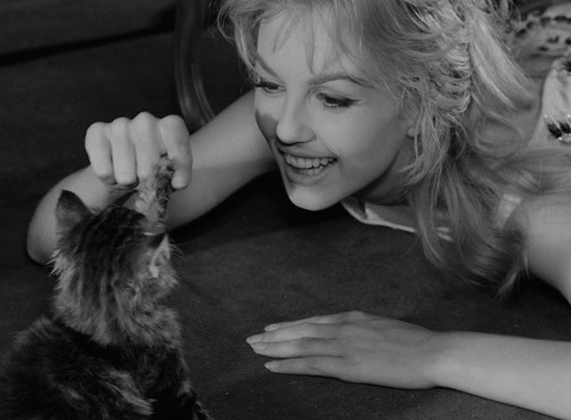 La notte brava - Laura Mylène Demongeot laying on floor playing with longhair tabby kitten