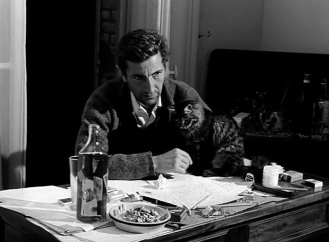 Nuit noire Calcutta - Maurice Garrel with longhair tabby cat on table