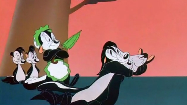 Odor-able Kitty - cartoon cat disguised as skunk in arms of Pepe Le Pew with wife and kids behind