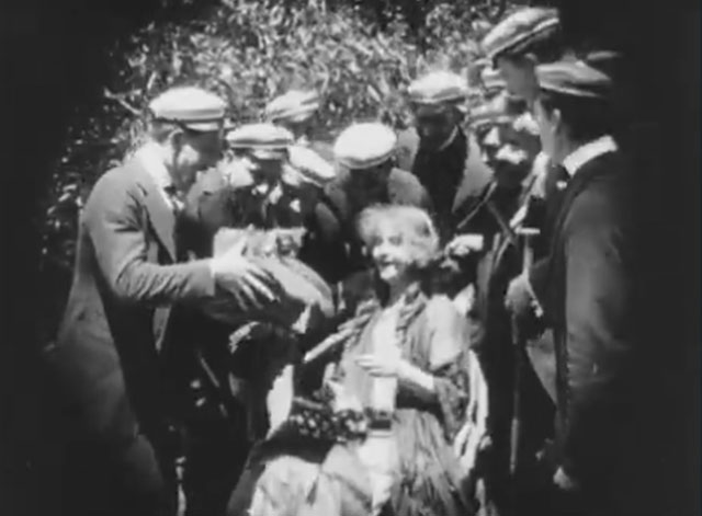 Ole Heidelberg - Katie Dorothy Gish presented a tabby kitten on a pillow by male students