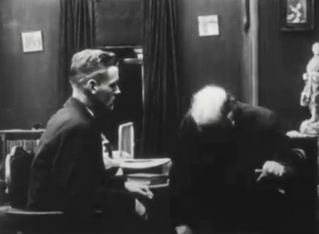 An Old Man's Love Story - tuxedo kitten on bed behind Cyril Frank O'Neil and Greythorne Van Dyke Brooke