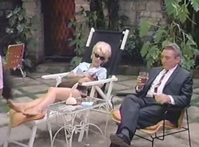 The Omegans - seal point Siamese cat in lap of Linda Ingrid Pitt on lawn chair with Valdemar Lucien Pan