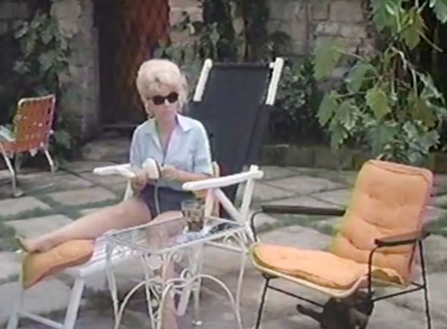 The Omegans - seal point Siamese cat under chair with Linda Ingrid Pitt 