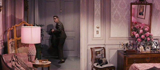 On the Double - Ernie Williams as Colonel MacKenzie Danny Kaye entering bedroom with Siamese cat Kim sitting on chair