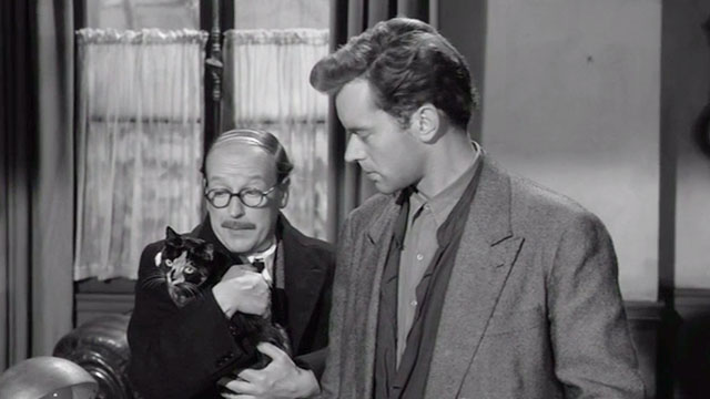 Orders to Kill - tortoiseshell and white cat Minou held by Lafitte Leslie French with Summers Paul Massie
