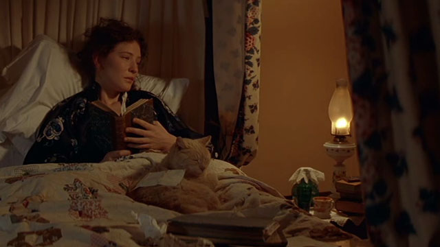 Oscar and Lucinda - Lucinda Cate Blanchett in bed with orange tabby cat and letter