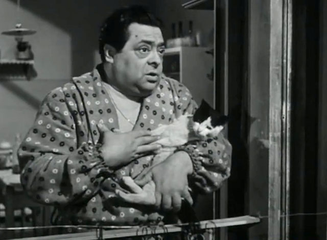 Papa diventa mamma - Guiseppe Aldo Fabrizi holding small tuxedo cat in window