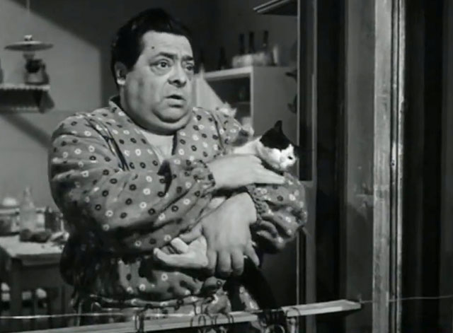 Papa diventa mamma - Guiseppe Aldo Fabrizi holding small tuxedo cat in window