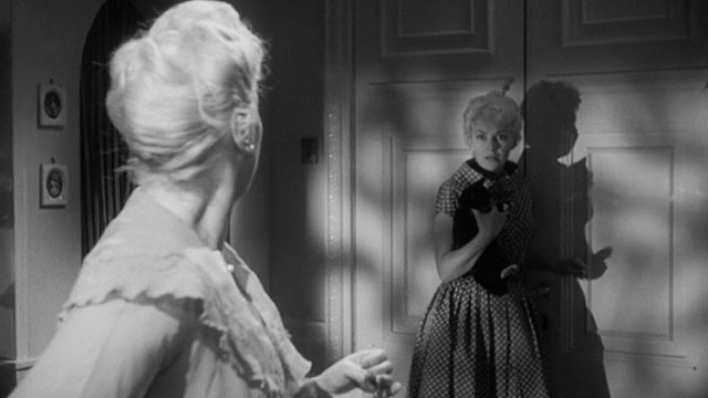 Passport to Shame - Room 43 - Malou Odile Versois holding black and white tuxedo kitten Mignon with Aggie Brenda de Banzie