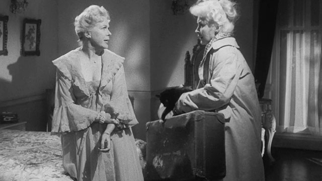 Passport to Shame - Room 43 - Malou Odile Versois holding black and white tuxedo kitten Mignon with Aggie Brenda de Banzie