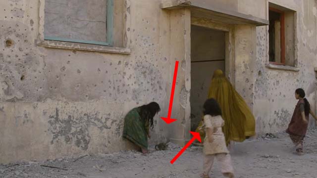 The Patience Stone - little girls playing with kittens in street