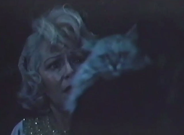 Persecution - Carrie Lana Turner looking at David holding silver Persian cat Sheba