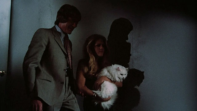 Pets - Bonnie Candice Rialson carrying white Angora cat Lila as she walks down the stairs with Stackman Ed Bishop