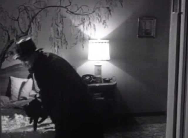 Please Murder Me - Joe Dick Foran picking up black cat from bed