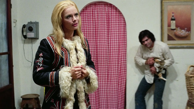 The Police Are Blundering in the Dark - La polizia brancola nel buio - man holding calico tabby cat in cafe looking at Enrichetta Blond Margaret Rose Keil