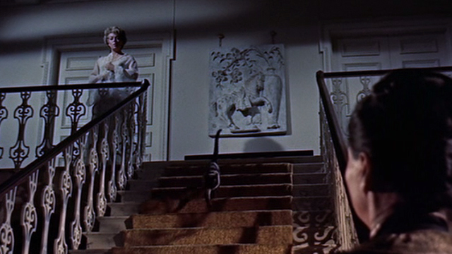 Portrait in Black - Sheila Lana Turner looking down at Tawny Anna May Wong as Siamese cat Rajah runs down stairs