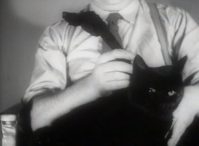 Post Early for Christmas 1943 - black cat with man trying to figure out knot in rope
