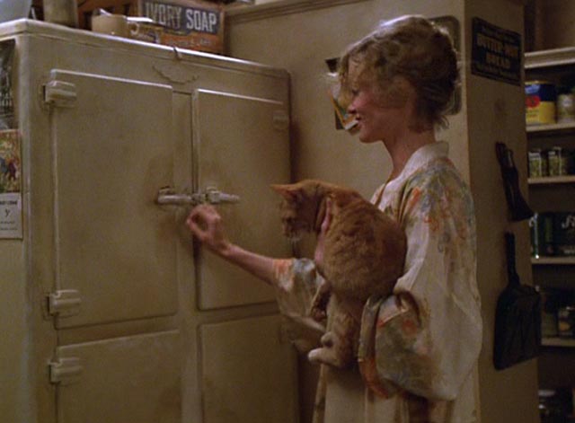The Postman Always Rings Twice 1981 - Cora Jessica Lange and orange tabby cat getting bottle of milk