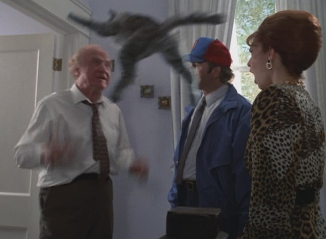 Problem Child - Big Ben Jack Warden with fake tabby cat Fuzzball flying at him and Amy Yasbeck and John Ritter
