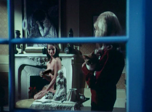 The Psycho Lover - ginger and white tabby cat Oscar held by Patricia Diane Jones in window with nude model