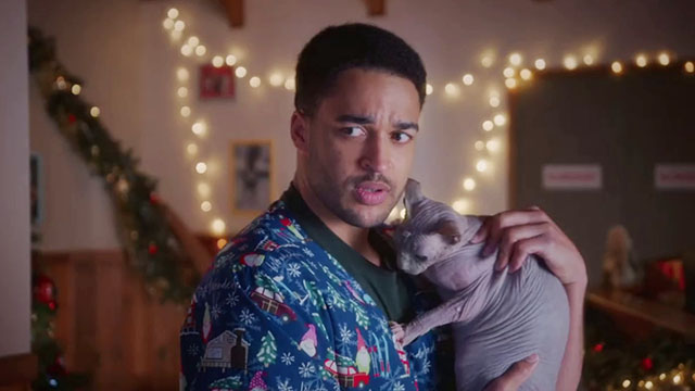 Puppy Love for Christmas - Dylan Ezekiel Simat holding hairless Sphynx cat Bigglesworth