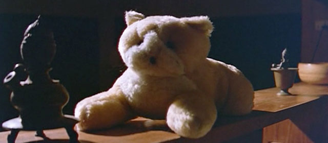 Raat - stuffed cat toy sitting on shelf