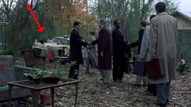 The Rainmaker - cats sitting on Buddy car in backyard before deposition