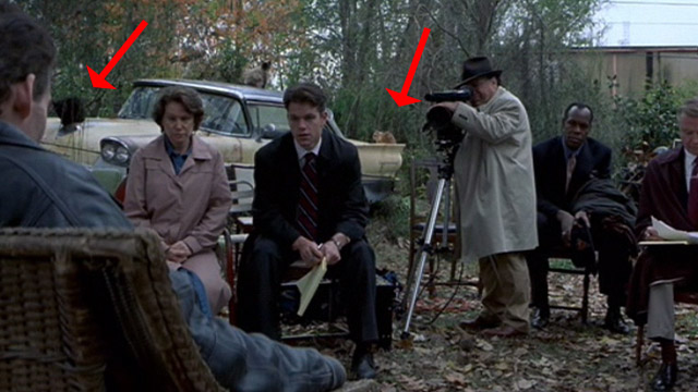 The Rainmaker - cats sitting on Buddy car in backyard during deposition