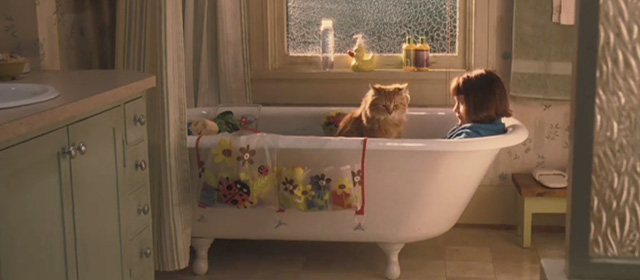 Ramona and Beezus - long-haired orange tabby cat Picky Picky Miller sitting in dry bathtub with Ramona Joey King