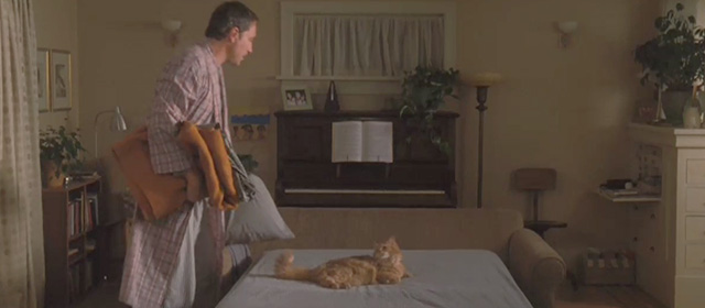 Ramona and Beezus - long-haired orange tabby cat Picky Picky Miller being shooed off bed by Mr. Quimby John Corbett