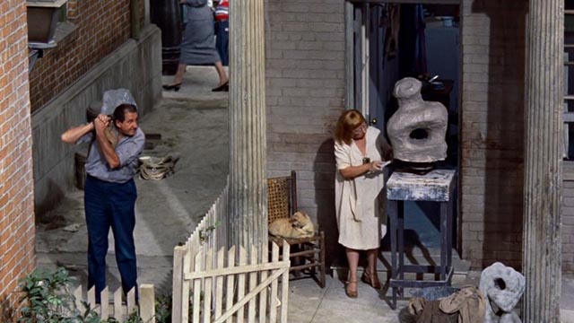 Rear Window - ice man stopping to talk to scultpor Jesslyn Fax with orange tabby cat on chair