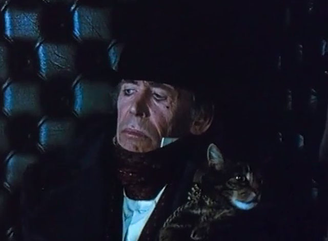 Rebecca's Daughters - Lord Sarn Peter O'Toole with brown tabby cat Rover in coach