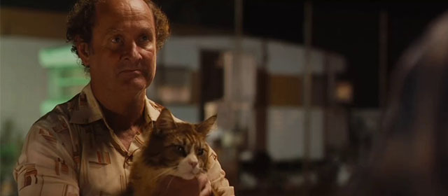 Red Dog - Mr. Cribbage Paul Blackwell holding longhair brown and white tabby cat Red Cat