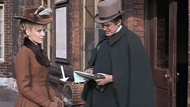 The Reptile - Valerie Jennifer Daniel and Harry Ray Barrett at train station with black cat Katie in carrier in background