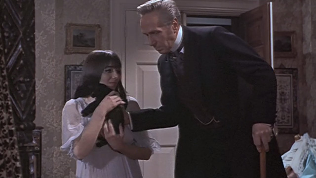 The Reptile - Dr. Franklyn Noel Willman pulling black kitten Katie away from daughter Anna Jacqueline Pearce