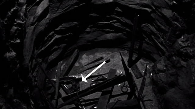 The Return of Dracula - tabby cat Nugget in hole in mine