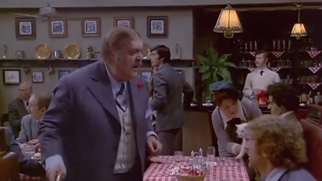 Rhinoceros - woman Anne Ramsey taking longhaired white cat from table behind John Zero Mostel and Stanley Gene Wilder