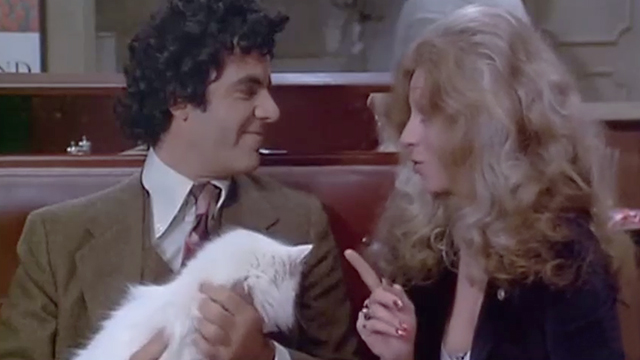 Rhinoceros - Robert Fields and Melody Santangello sitting with longhaired white cat at table